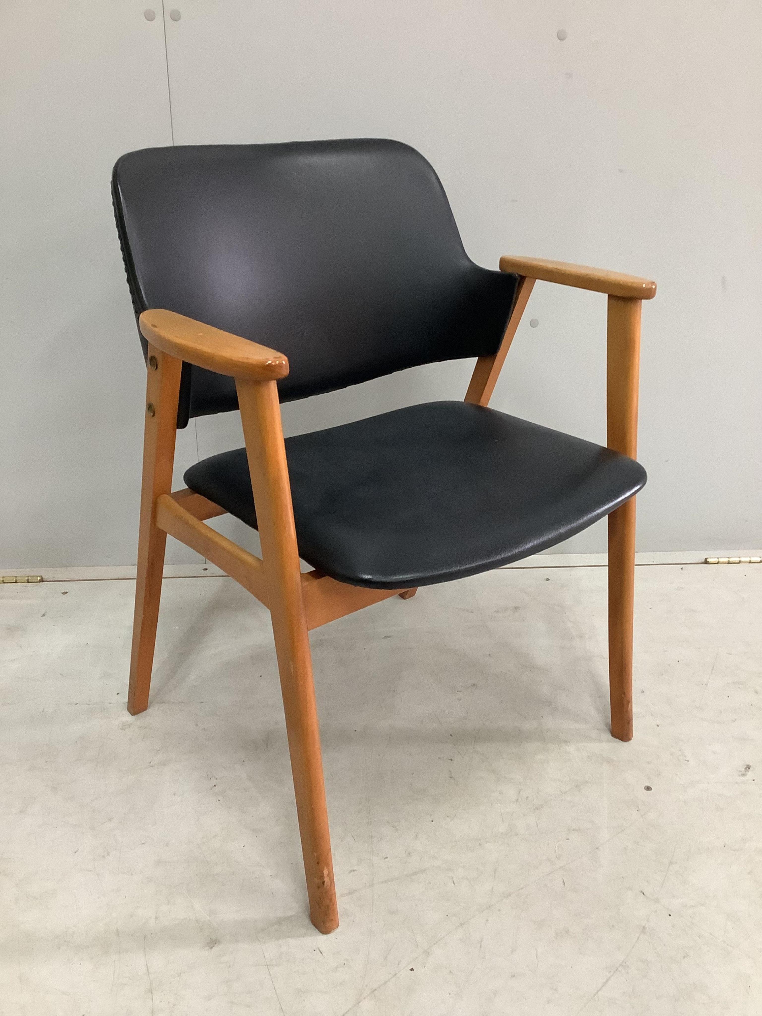 A mid century Danish Teak and Leather arm chair by Erik Kirkegaard for Glostrup, width 61cm, depth 43cm, height 75cm. Condition - fair to good